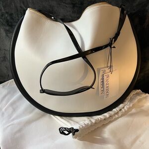 JW Anderson Moon Bumper Bag. White with black trim
